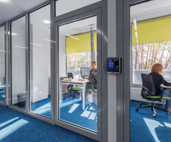 Modern and light office interior with glass wall